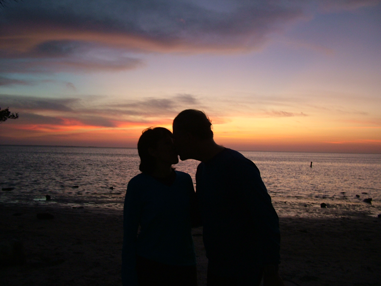 couple at sunset, couple by the shore, kissing, sunrise, couple at sunrise, Christian marriage, Christian couple