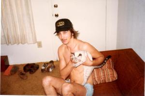 man with cat, Robert Lech, Rob Lech, man wearing baseball hat, man in apartment, guy with cat, pet cat