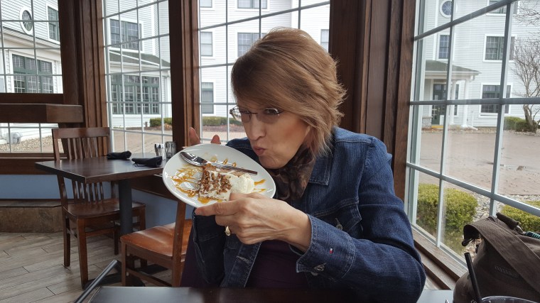 woman, birthday cake, birthday, carrot cake, celebration, lunch, with husband, Christian, woman kissing cake, table by the window, lake view