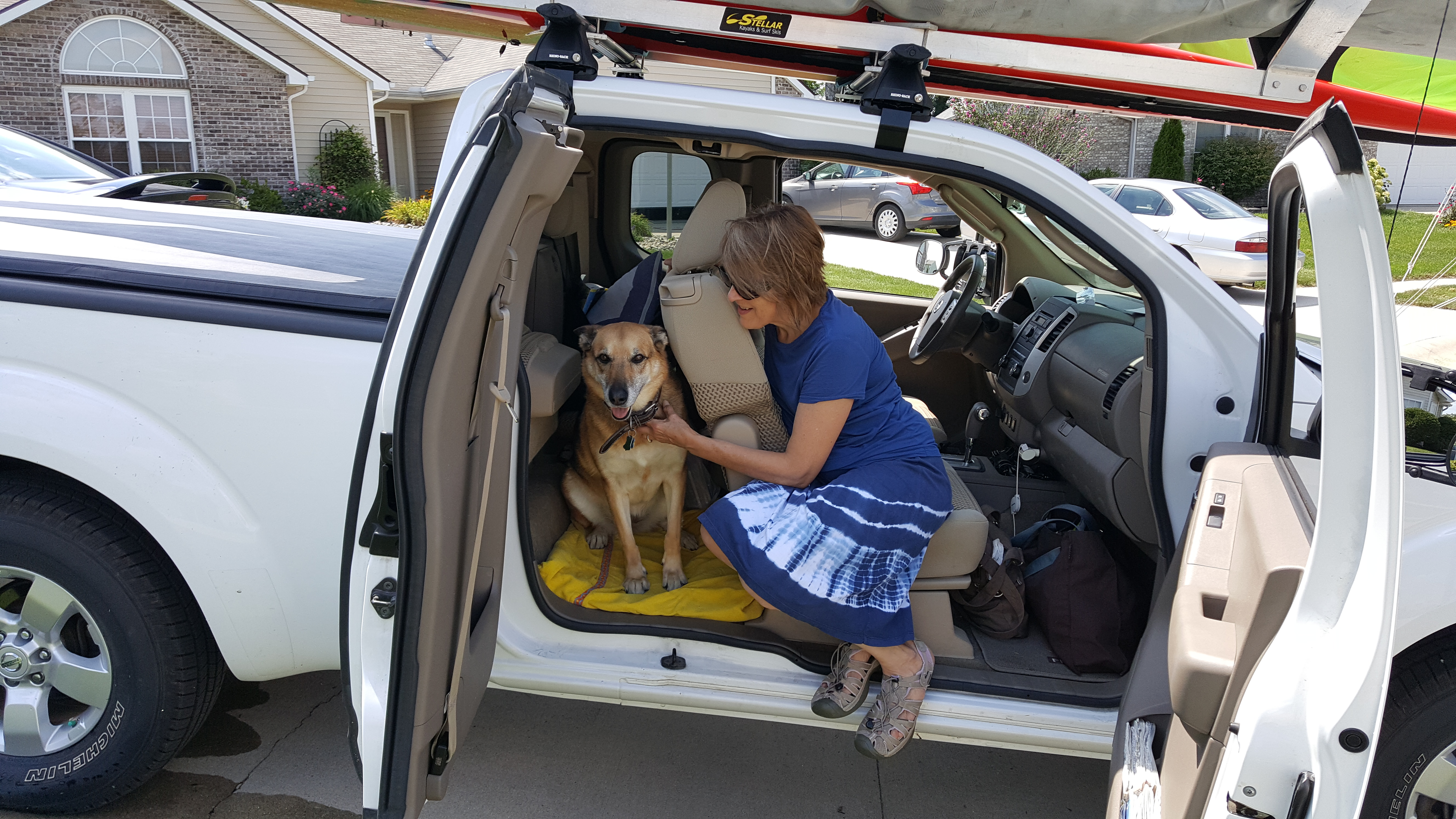 dog in truck, jump seat, German shepherd, woman and dog, travelling, Nissan Frontier, pet dog